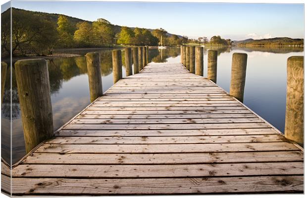 Jetty at Coniston Water with Yacht in Background Canvas Print by Stephen Mole