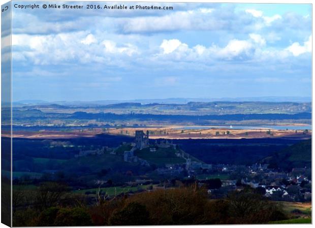 Corfe Castle and beyond. Canvas Print by Mike Streeter