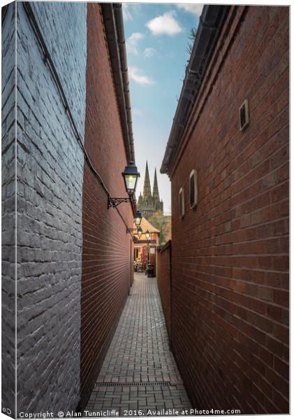 Lichfield cathedral spires Canvas Print by Alan Tunnicliffe