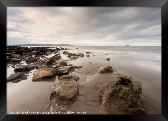 Rocks and Sand Framed Print by Chris Sweet