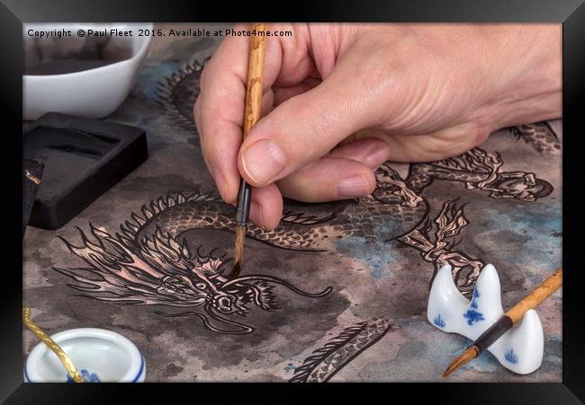 Artist painting a Chinese dragon Framed Print by Paul Fleet