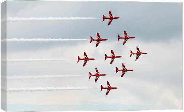 Red Arrows flying in diamond formation Canvas Print by Simon Marshall