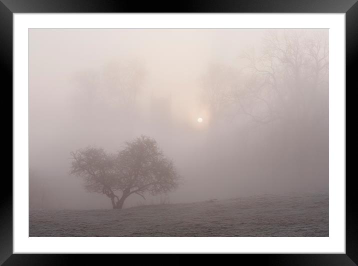 Sunrise through fog behind Hilborough Church. Norf Framed Mounted Print by Liam Grant