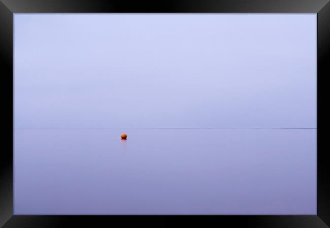 Cloudy sky a bouy reflected in a calm ocean at twi Framed Print by Liam Grant