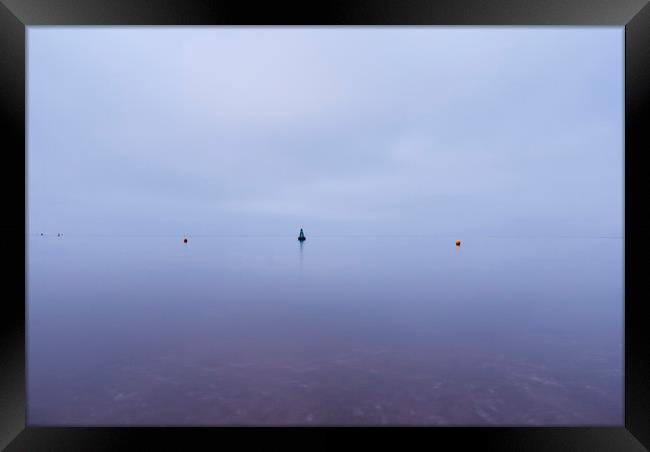 Cloudy sky a bouys reflected in a calm ocean at tw Framed Print by Liam Grant