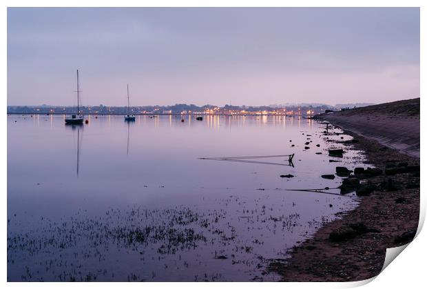 Boats and distant harbour reflected at twilight. W Print by Liam Grant