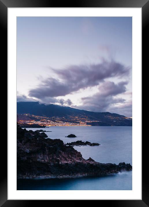 Volcanic coastline and lights of Santa Cruz at twi Framed Mounted Print by Liam Grant