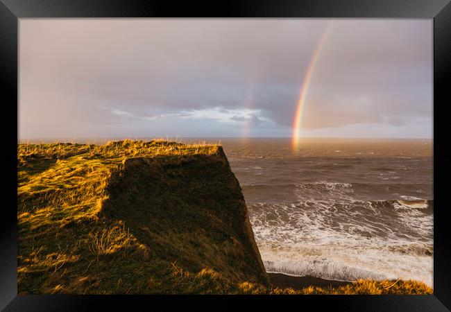 Rainbow and stormy sky at sunset. Sheringham, Norf Framed Print by Liam Grant