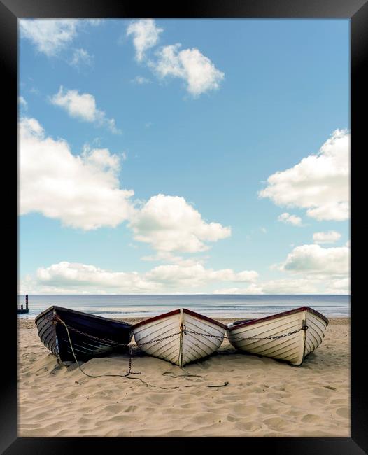 Fishing boats on a beach  Framed Print by Shaun Jacobs