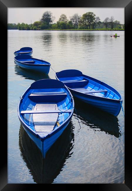 Blue boats on a lake Framed Print by Oxon Images