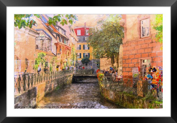 A stream in a town  Framed Mounted Print by sylvia scotting