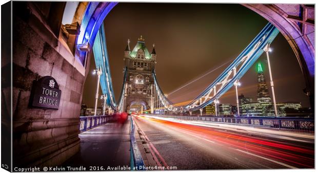 Tower Bridge - Lights passing by. Canvas Print by Kelvin Trundle