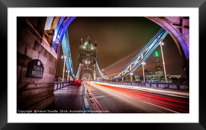 Tower Bridge - Lights passing by. Framed Mounted Print by Kelvin Trundle