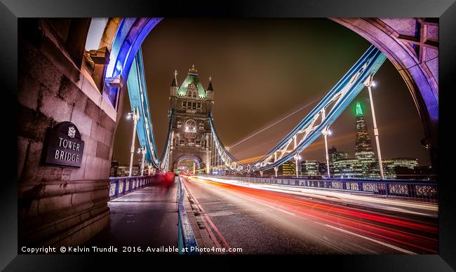 Tower Bridge - Lights passing by. Framed Print by Kelvin Trundle