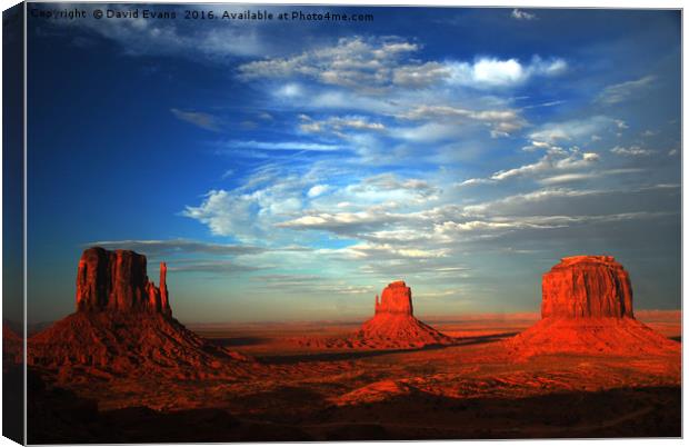 Sunset over Monument Valley Canvas Print by David Evans