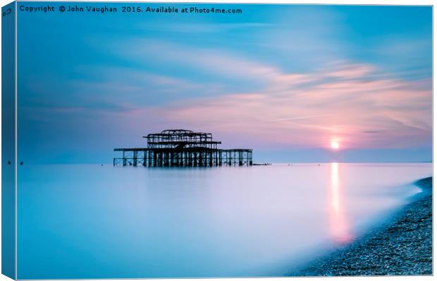 Sunset at Brighton West Pier Canvas Print by John Vaughan