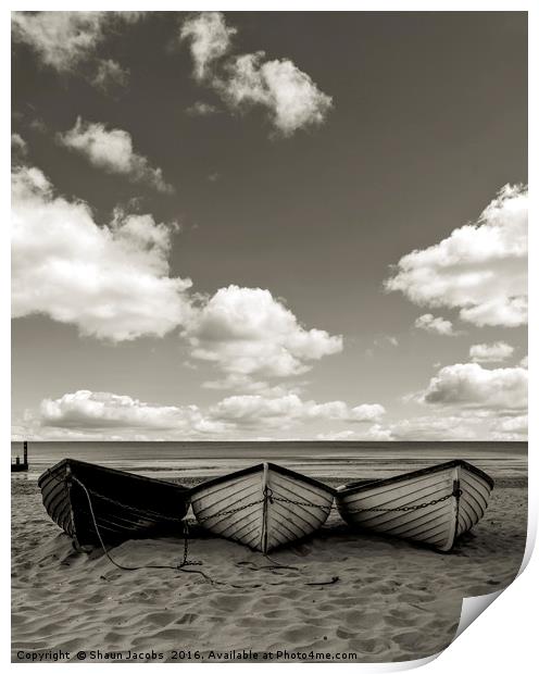 Fishing boats on a beach Print by Shaun Jacobs