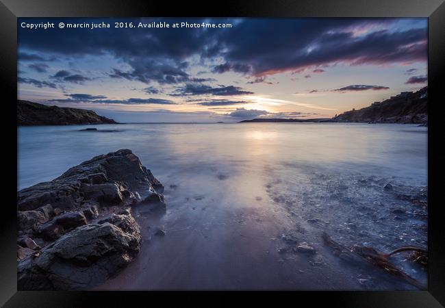 Sunset at rocky beach with slow motion blur water Framed Print by marcin jucha