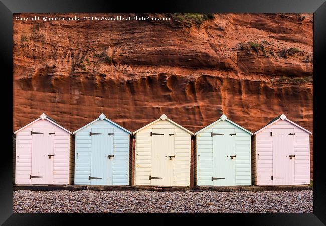 Beach hut row in pastel colors, red rock backgroun Framed Print by marcin jucha