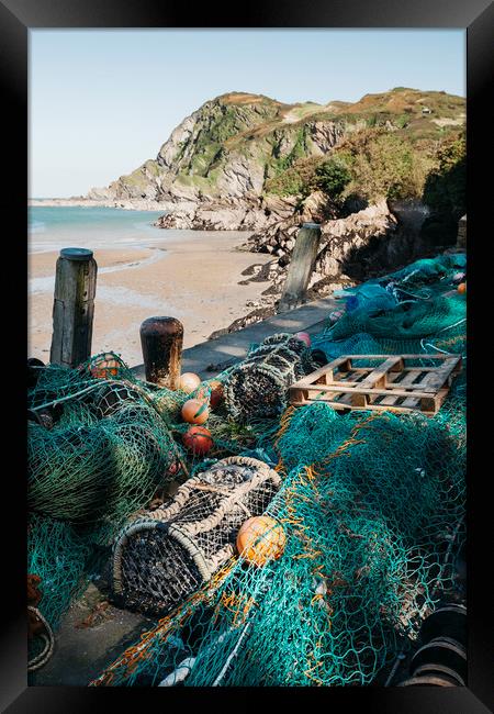 Fishing nets and lobster pots in the harbour at Il Framed Print by Liam Grant