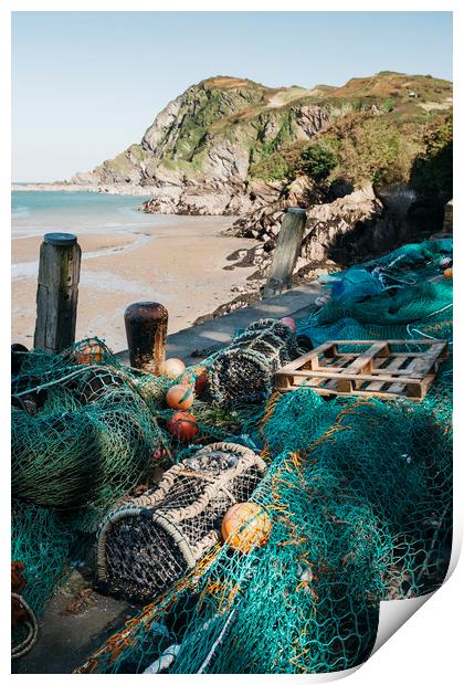 Fishing nets and lobster pots in the harbour at Il Print by Liam Grant