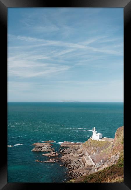 Lighthouse at Hartland Quay with Lundy Island beyo Framed Print by Liam Grant