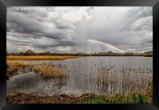 Rainbow over the water Framed Print by Brian Fagan