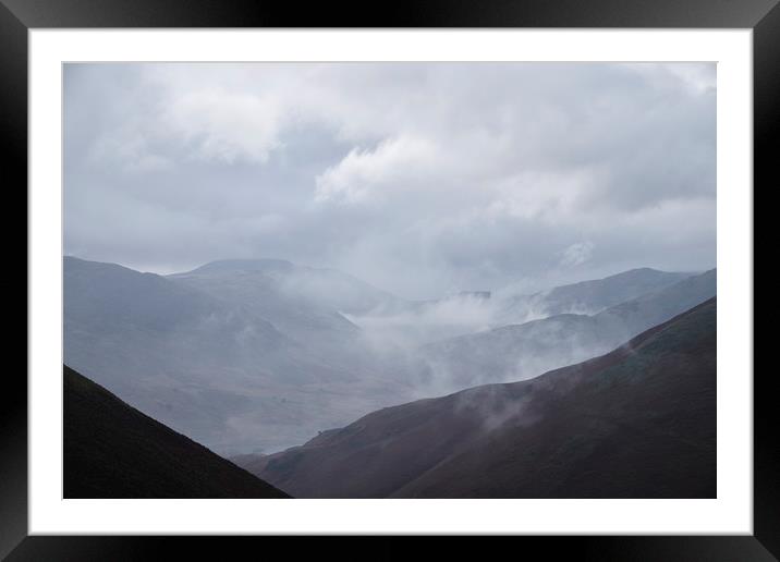 Rain clouds rolling through the mountains. Cumbria Framed Mounted Print by Liam Grant