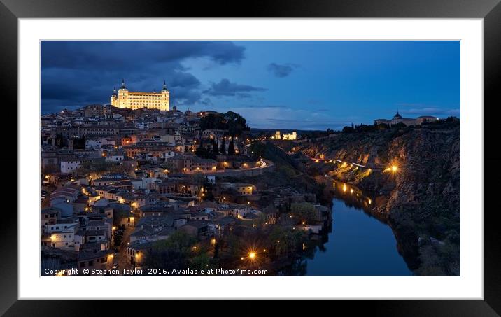 Dark clouds and city lights Framed Mounted Print by Stephen Taylor