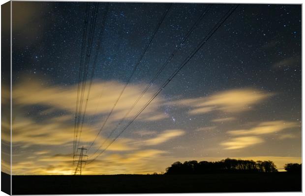 Electricity pylons, stars and clouds. West Acre, N Canvas Print by Liam Grant