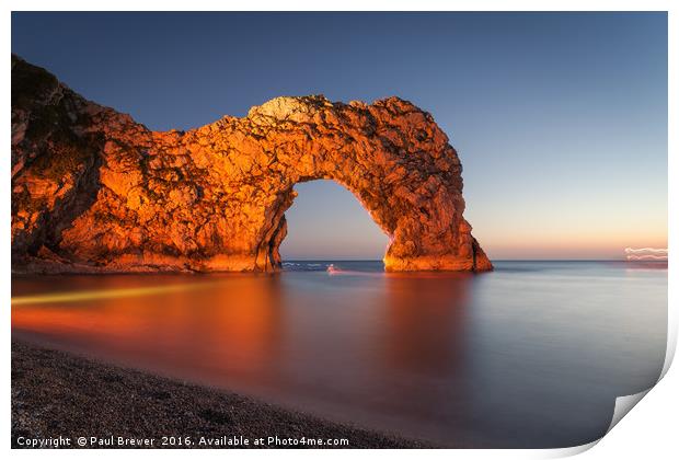 Durdle Door Dorset with an illuminated Canoeist   Print by Paul Brewer