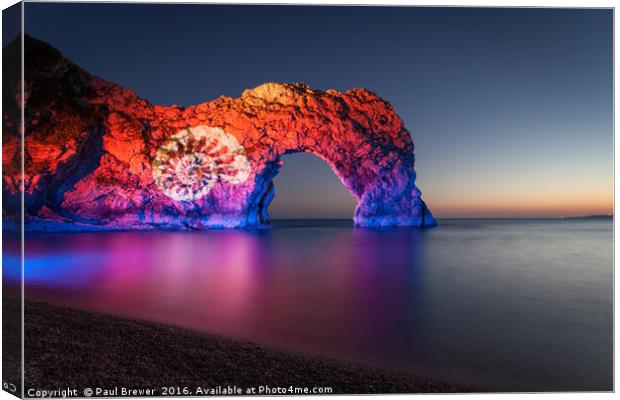 Durdle Door illuminated at night Canvas Print by Paul Brewer