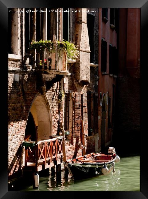 Boat moored on a Canal, Venice Framed Print by Ian Collins