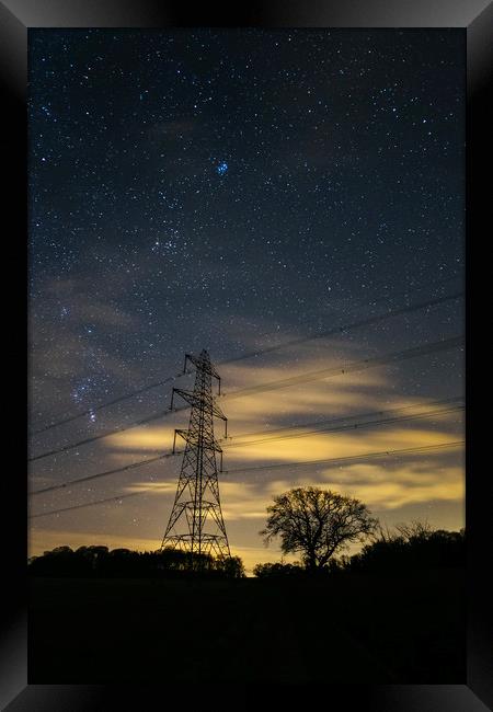 Electricity pylons, stars and clouds. West Acre, N Framed Print by Liam Grant