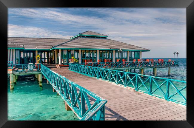 Restaurant over water in Maldives Framed Print by Jenny Rainbow