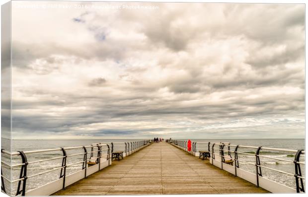 Looking down the pier Canvas Print by Phil Reay
