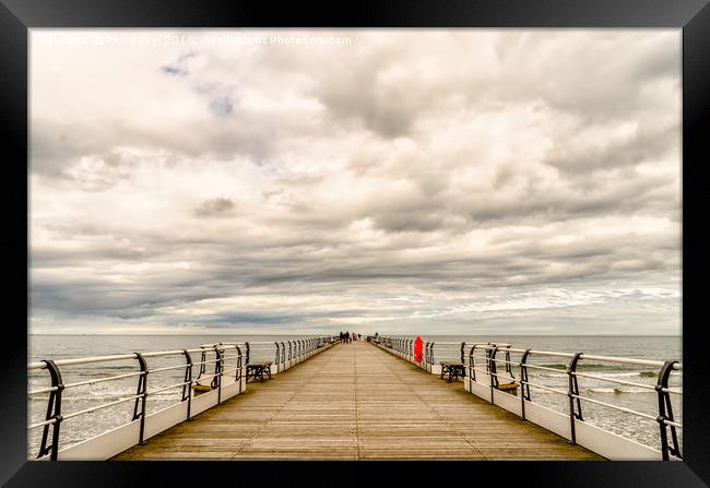 Looking down the pier Framed Print by Phil Reay
