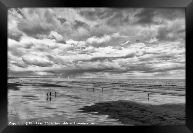 Reflections on the sand Framed Print by Phil Reay