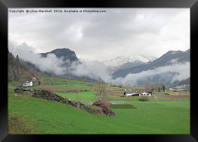 Rolling mist in the Swiss Alps.  Framed Print by Lilian Marshall