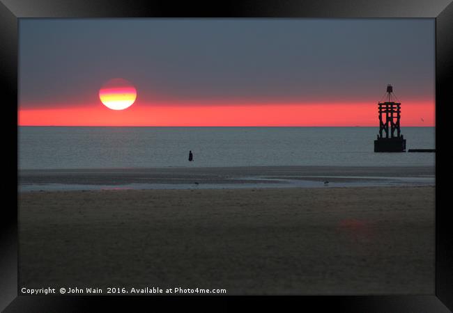 Sunset before the storm Framed Print by John Wain