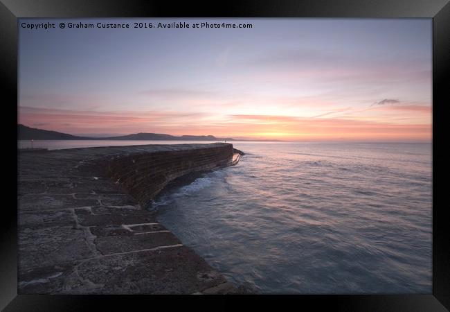 Sunrise at The Cobb, Lyme Regis Framed Print by Graham Custance