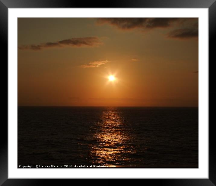 Golden setting sun on sea Framed Mounted Print by Harvey Watson