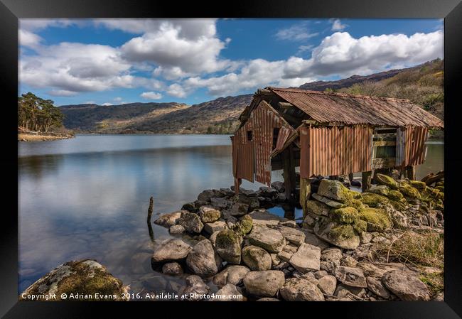 Rusty Boathouse Framed Print by Adrian Evans