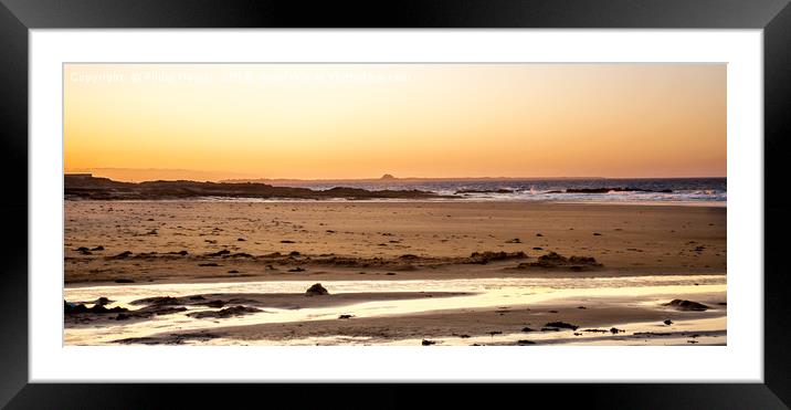 Sun goes down on Bamburgh beach......... Framed Mounted Print by Naylor's Photography