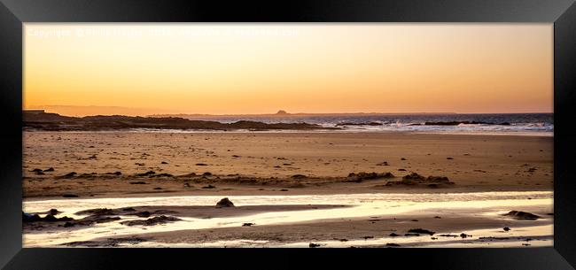 Sun goes down on Bamburgh beach......... Framed Print by Naylor's Photography