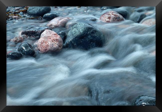 water over pebbles Framed Print by Michael Hopes