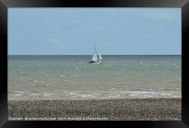 Sail boat on the sea water Framed Print by Jordan Hawksworth