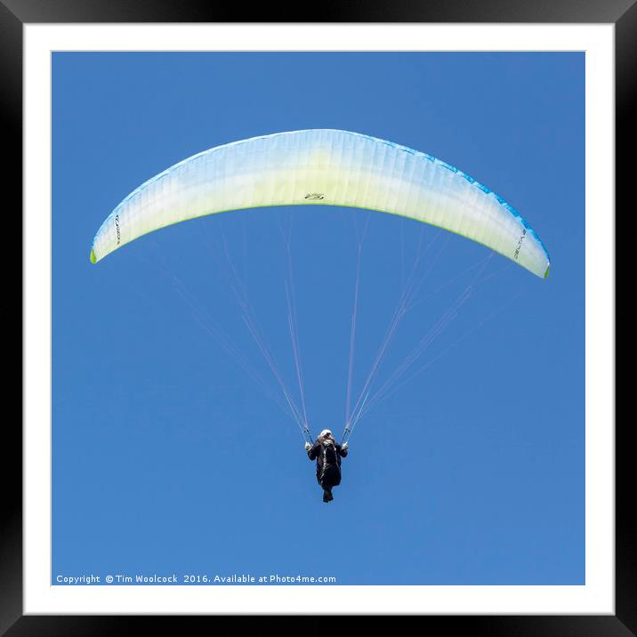 Paraglider enjoying the beautiful weather  Framed Mounted Print by Tim Woolcock