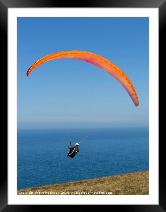 Paraglider enjoying the beautiful weather  Framed Mounted Print by Tim Woolcock