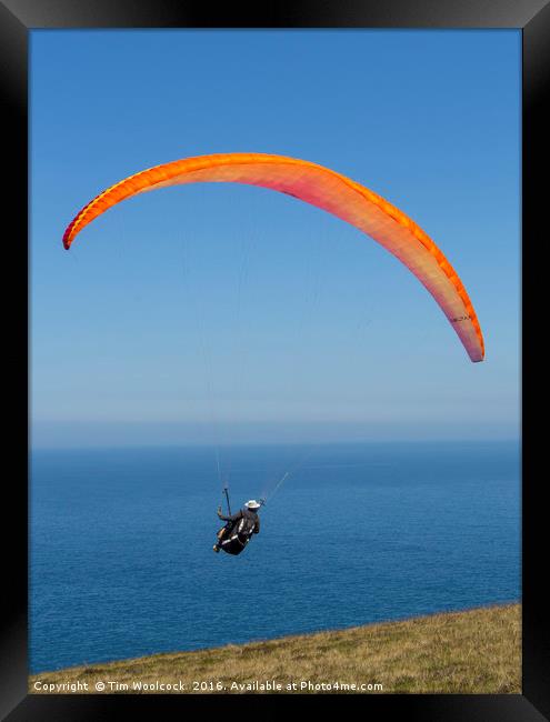 Paraglider enjoying the beautiful weather  Framed Print by Tim Woolcock